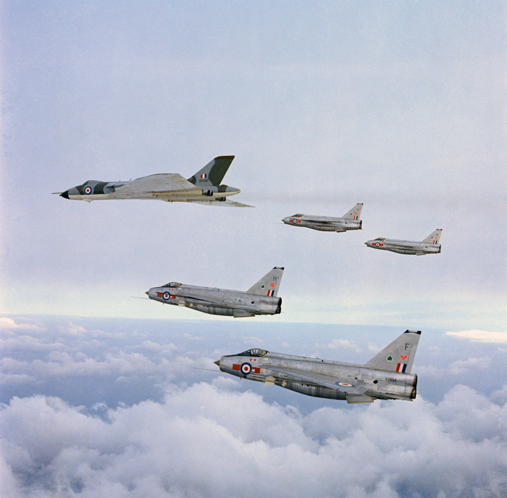 Avro Vulcan B2 (serial XH561) of the RAF's 'Waddington Wing' leads four English Electric Lightning F6 fighters in a formation flight to mark the creation of RAF Strike Command on 30 April 1968. Image: MOD Crown Copyright/RAF Air Historical Branch 