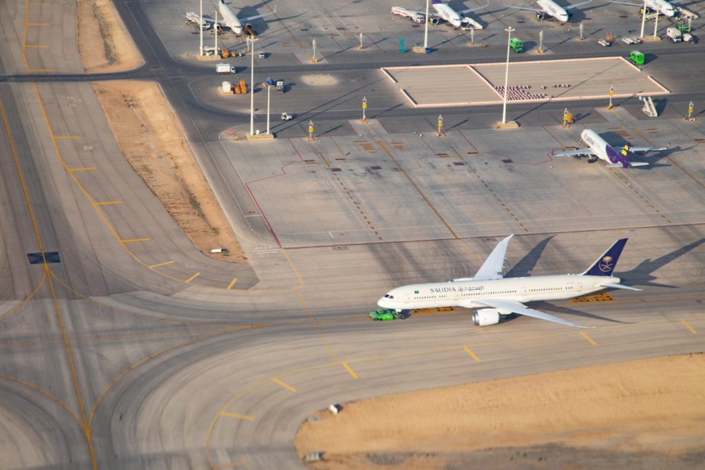 Riyadh - March 05: Planes preparing for take off at Riyadh King Khalid Airport on March 05, 2023 in Riyadh, Saudi Arabia. Riyadh airport is home port for Saudi Arabian Airlines.