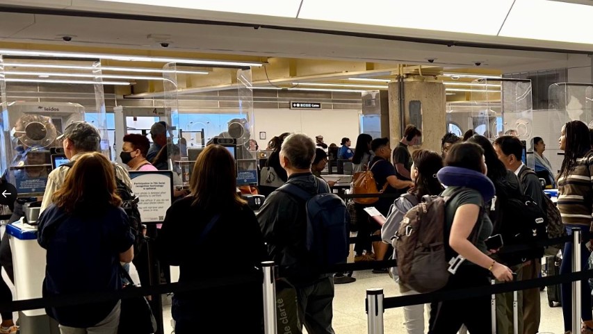 Passengers in line for TSA