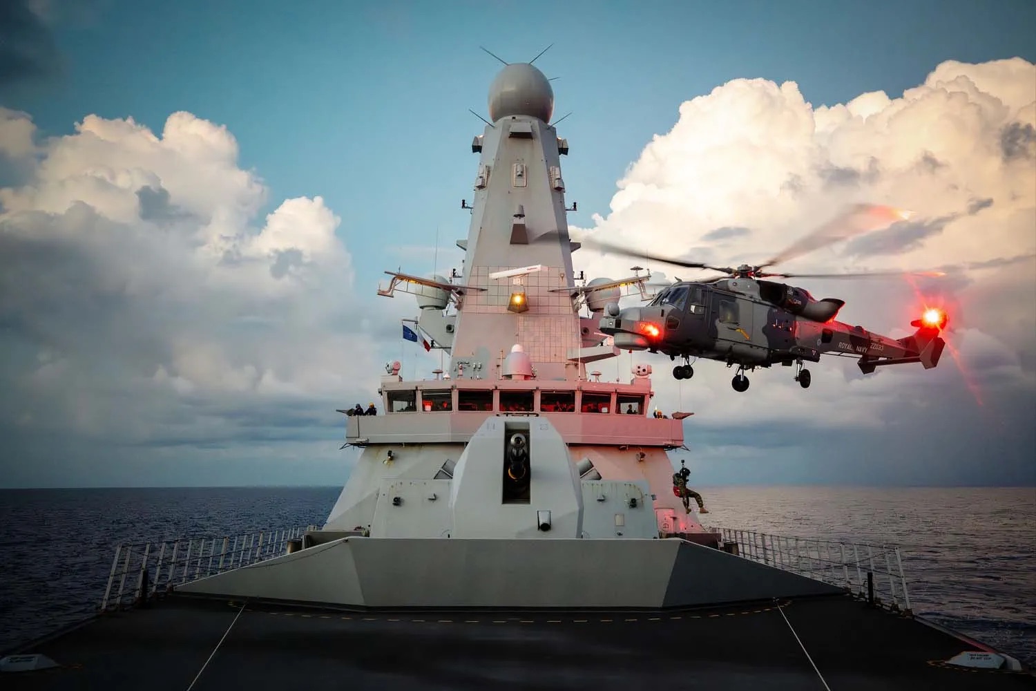 Royal Navy Leonardo AW159 Wildcat prepares to land on the deck of HMS Dragon