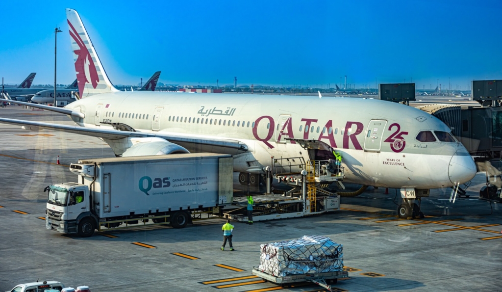DOHA, QATAR - OCT 13, 2025: Qatar Airways Boeing 787 Dreamliner during cargo loading at Hamad International Airport in Doha, Qatar