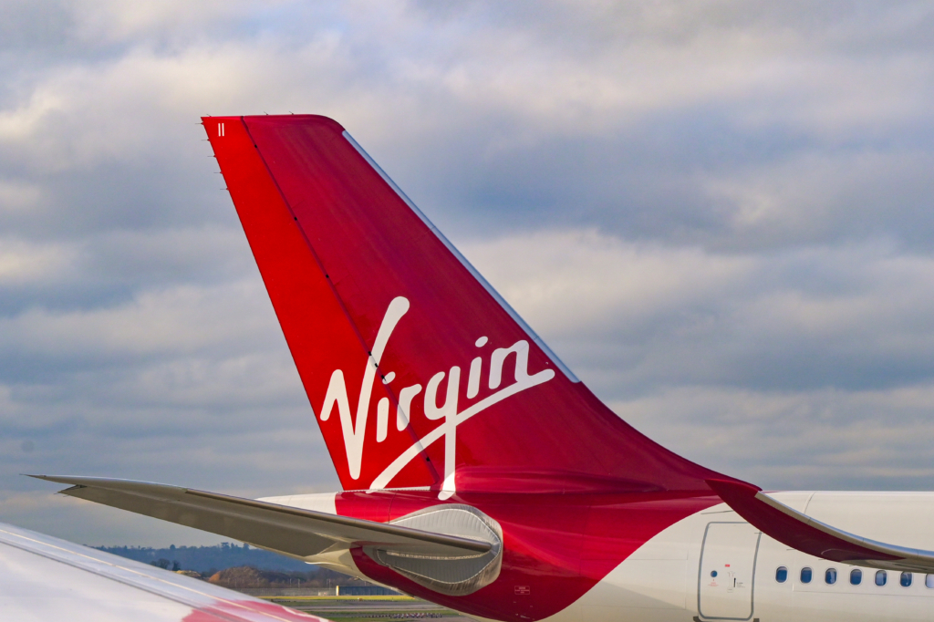 London, England, UK - 11 January 2024: Tail fin of a passenger jet operated by Virgin Atlantic Airways