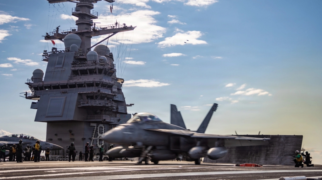 Aircraft carrier with fighter jet on the deck