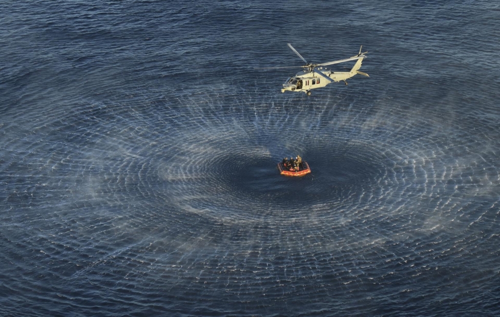 NASA crew recovery from Orion spacecraft by US Navy MH60 seahawk helicopter
