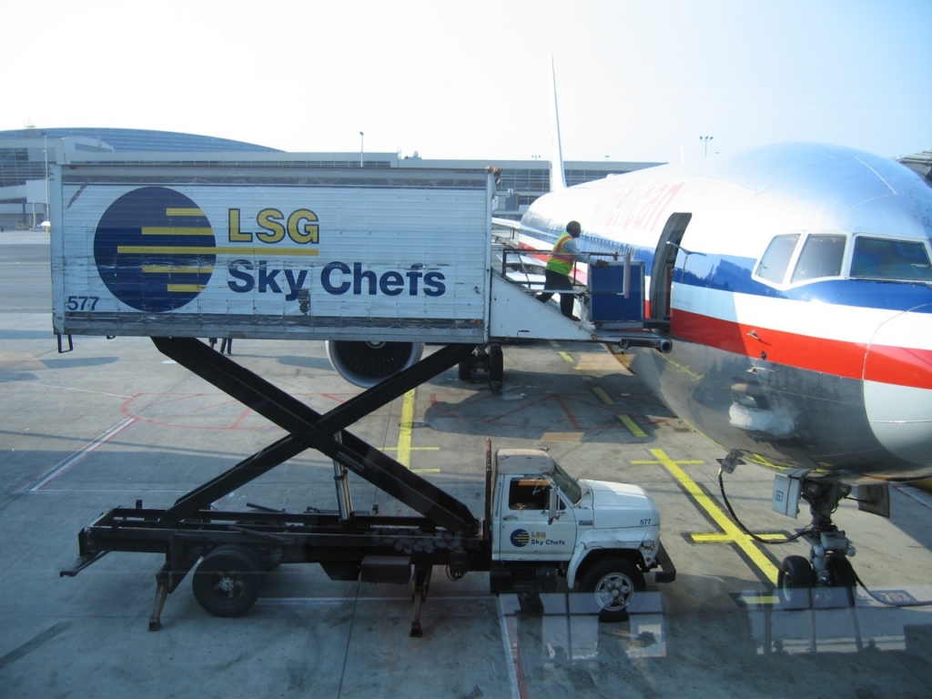 LSG Sky Chefs truck loading meals on an American Airlines Boeing 767 aircraft