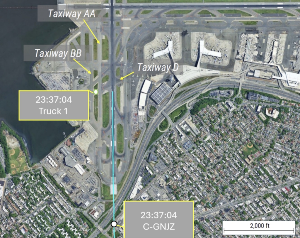 Fire truck enters the runway at La Guardia as Air Canada Jazz CRJ-900 touches down