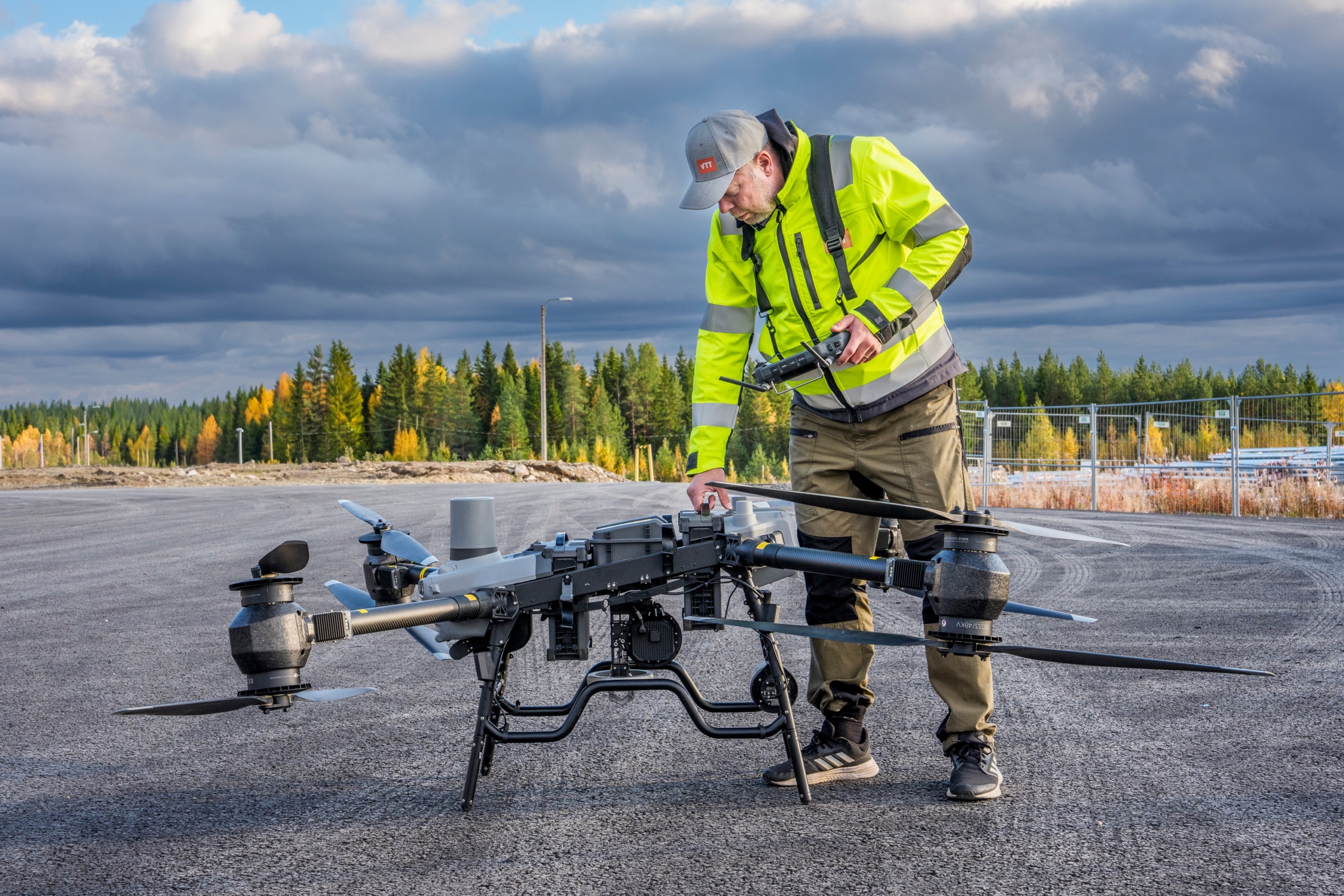 VTT Senior Scientist Jussi Kangasoja working with a drone at Finland's arctic drone test site