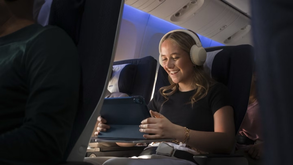 British Airways Starlink internet customer wearing headphones