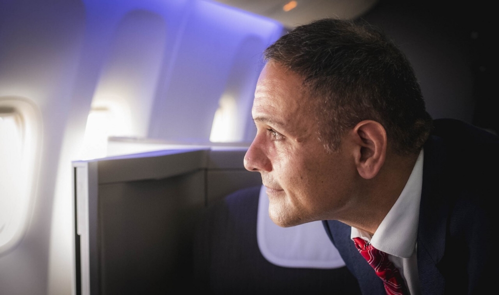BA cabin crew member looking out of the window