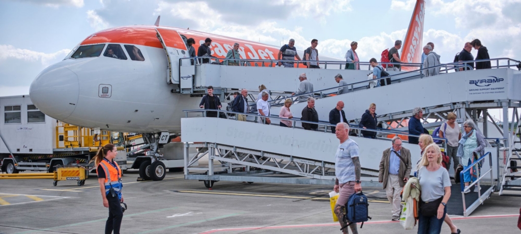 Passengers board easyJet aircraft at London Southend Airport