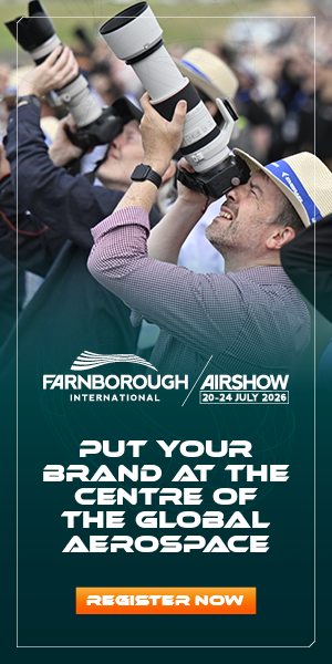 A photographer with a large telephoto lens captures aircraft at an airshow, with promotional text for Farnborough International Airshow encouraging businesses to register and showcase their aerospace brands.