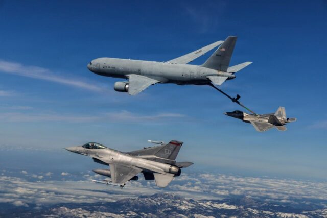 A KC-46 Pegasus assigned to the 418th Flight Test Squadron, Global Reach Combined Test Force, refuels an F-22 Raptor assigned to the 411th Flight Test Squadron, Air Dominance Combined Test Force while an F-16 assigned to the 416th Flight Test Squadron, Airpower Foundations Combined Test Force, awaits a turn over the Mojave Desert on March 3, 2026. Partnerships between the Combined Test Forces at Edwards helps expedite critical capability for the warfighter by leveraging multiple program portfolios in tandem. In this scenario, the F-16 aircraft was operating as a target for key F-22 Raptor test points while the KC-46 was able to collect additional data for aerial refueling efforts. (Courtesy photo)
