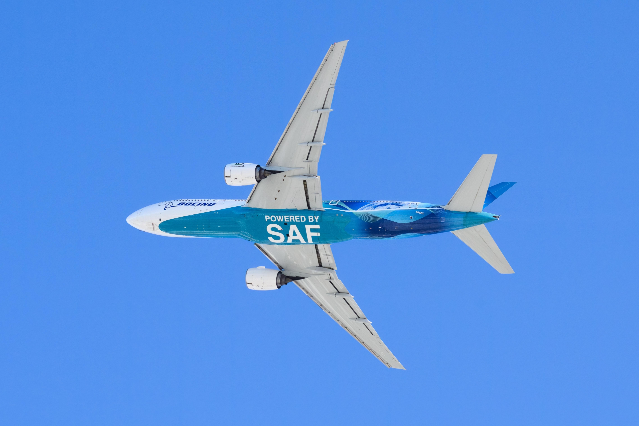 Boeing 777 underside with powered by SAF Sustainable Aviation Fuel text