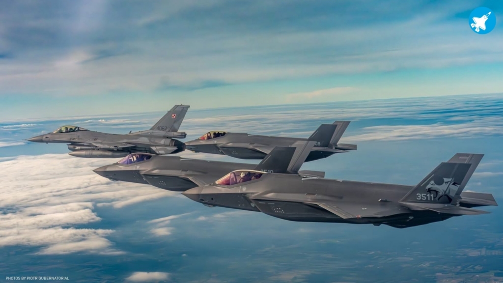 Poland's first three operational F-35As (serials 3509, 3510 and 3511) fly in formation with a PoAF-operated F-16C Block 52+ Fighting Falcon (serial 4057) during the national flypast conducted during the latter's induction ceremony on 12 June 2026. Image: Lockheed Martin/Piotr Gubernatorial via X