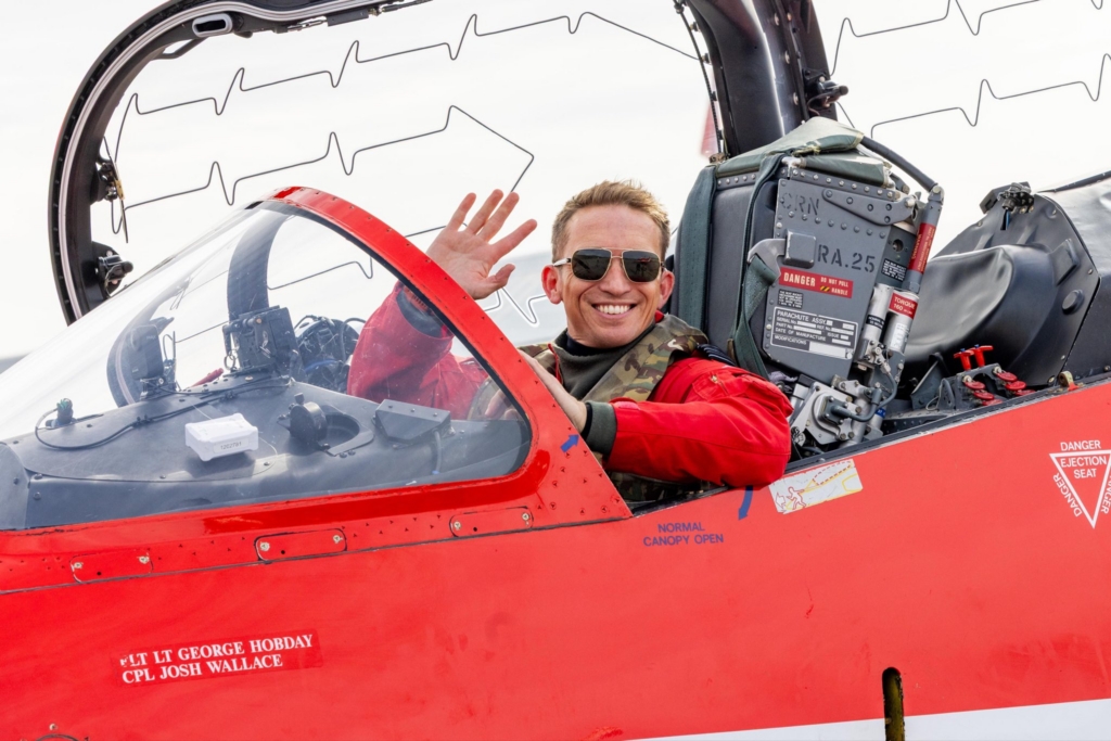 Red Arrows pilot waves as the team arrives in Greenland