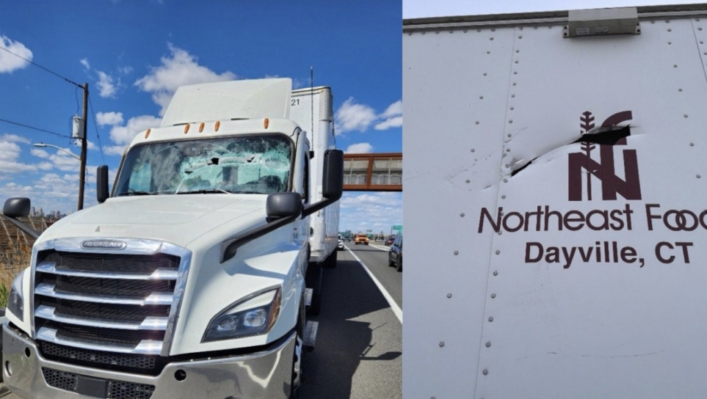 Truck damaged by light pole debris after United Airlines aircaft hit lightpole