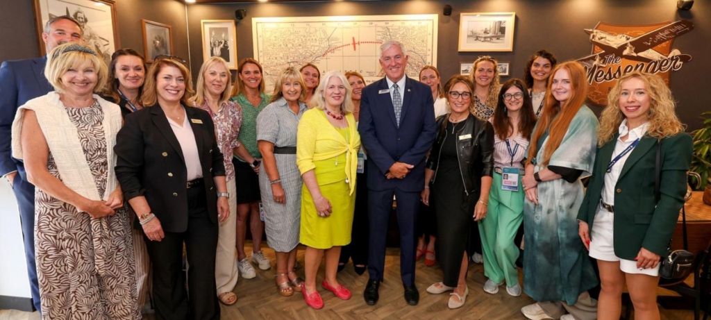 Women in Aviation International CEO Lynda Coffman (in black, front centre) at Farnborough International Airshow 2026