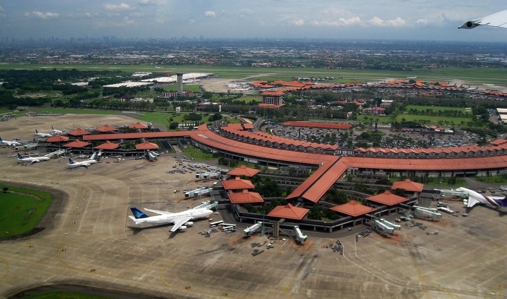 Aerial view of Soekarno-Hatta International Airport, Jakarta (edited horizon). The view taken in 2 January 2010 from Garuda Indonesia airplane during take-off. The architecture reflect Indonesian vernacular architecture of Javanese Joglo roof with Pendopo as gate lounges (waiting hall) surrounded with tropical gardens.