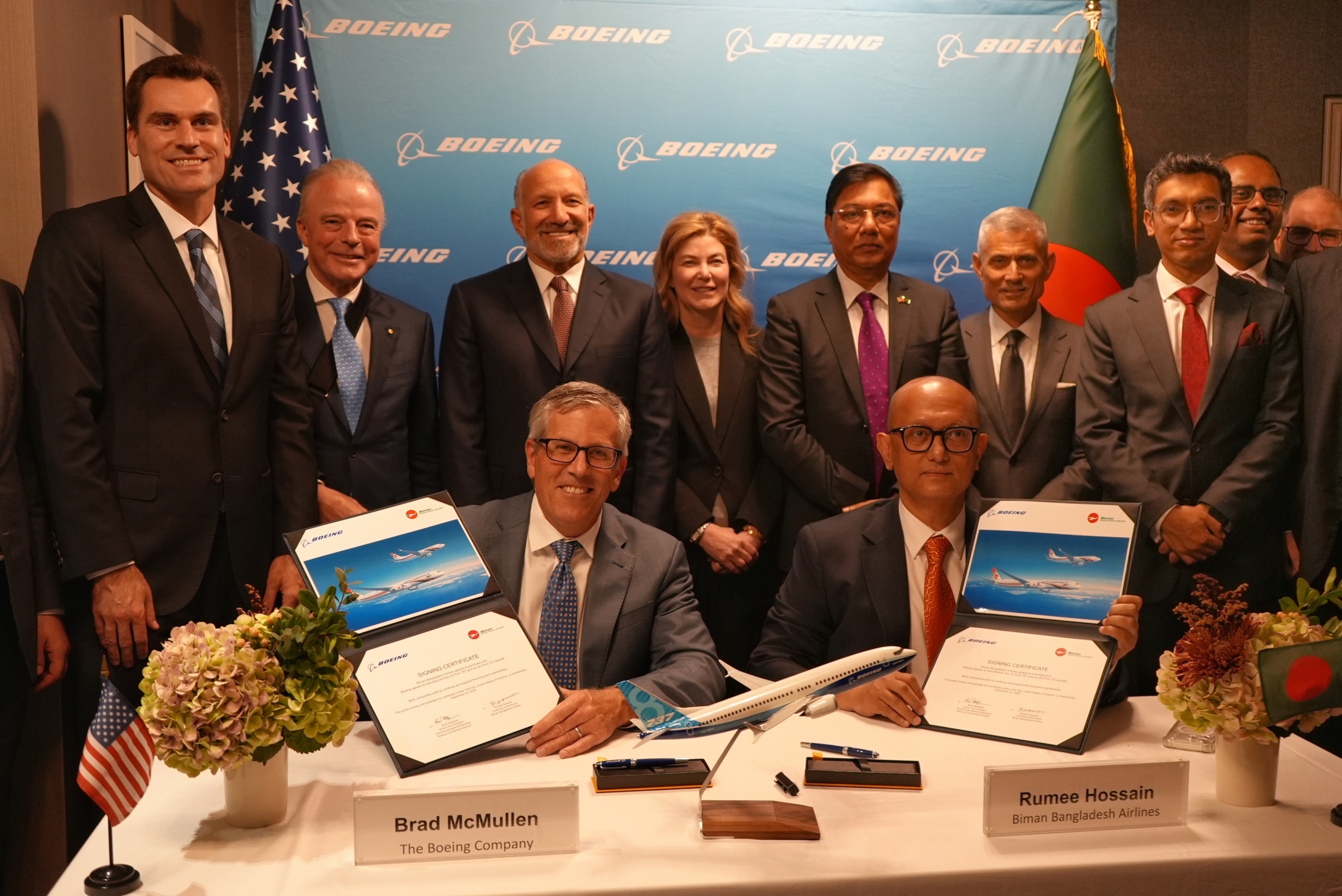 Boeing and Biman Bangladesh leaders today announced the airline ordered 11 more Boeing airplanes. Front, from left: Brad McMullen, Boeing senior vice president of Commercial Sales and Marketing, and Rumee A. Hossain, chairman of Biman Bangladesh Airlines. Back row, from left: William Kimmitt, Under Secretary of Commerce for International Trade; Brendan Nelson, Boeing Global senior vice president; Howard Lutnick, U.S. Secretary of Commerce; Stephanie Pope, Boeing Commercial Airplanes president and CEO; Rashiduzzaman Millat, Bangladesh Minister of Civil Aviation and Tourism; S. Paul Kapur, Assistant Secretary of State for South and Central Asian Affairs; Chowdhury Ashik Mahmud Bin Harun, chairman of Invest Bangladesh Authority; Kaanthi Bhuvanagiri, Boeing sales director for India and South Asia; Paul Righi, Boeing vice president of Commercial Sales and Marketing for Eurasia, India and South Asia.
