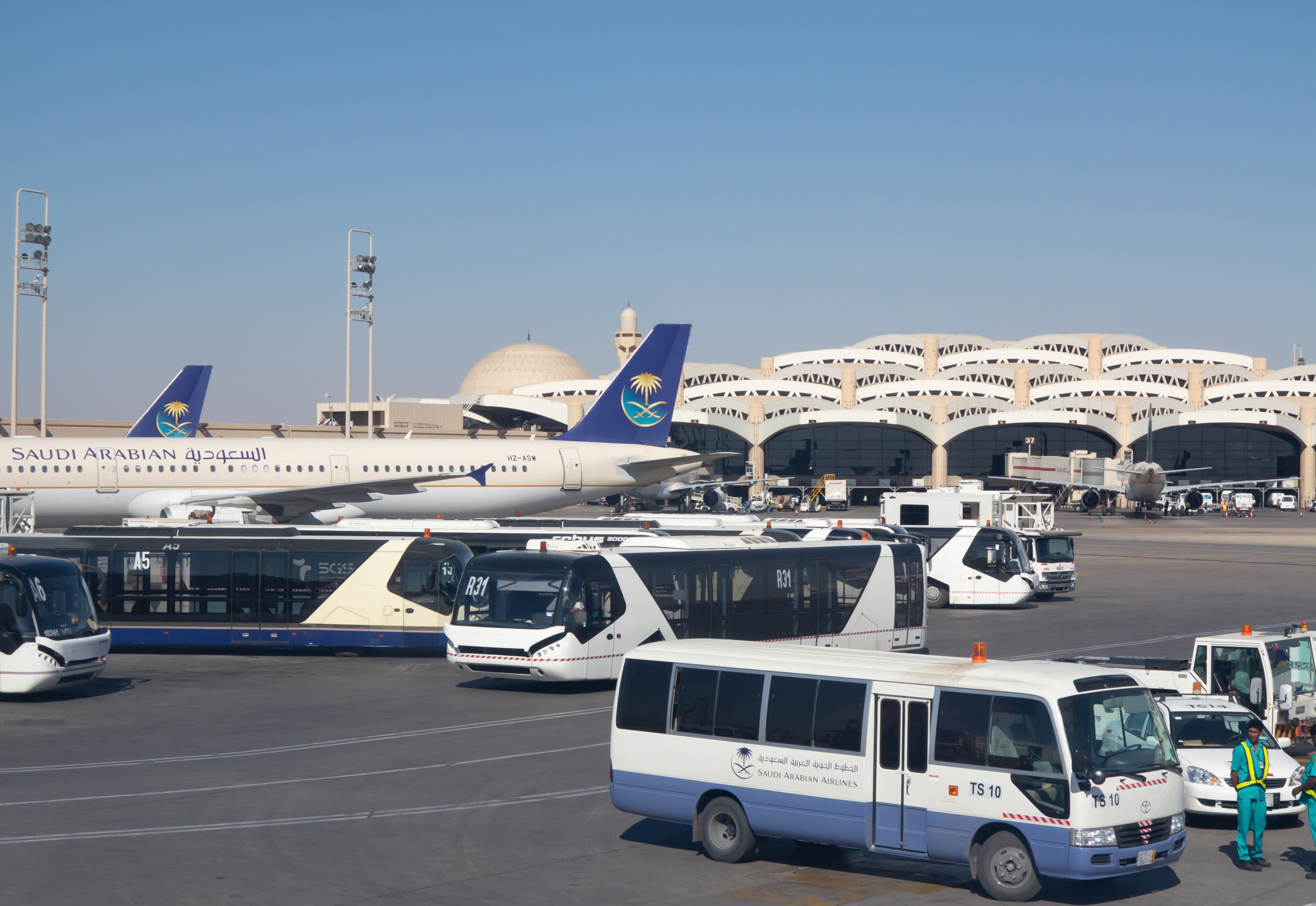 Riyadh - March 01: Planes preparing for take off at Riyadh King Khalid Airport on March 01, 2016 in Riyadh, Saudi Arabia. Riyadh airport is home port for Saudi Arabian Airlines.
