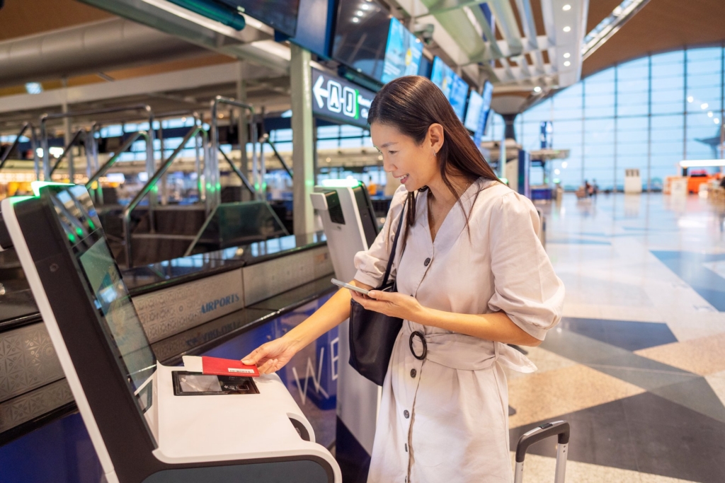 A passenger uses biometric identify to get into the airport
