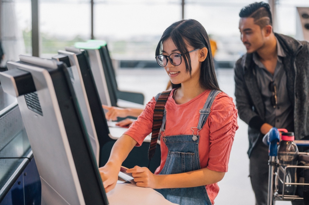 A passenger uses biometric identify to get into the airport