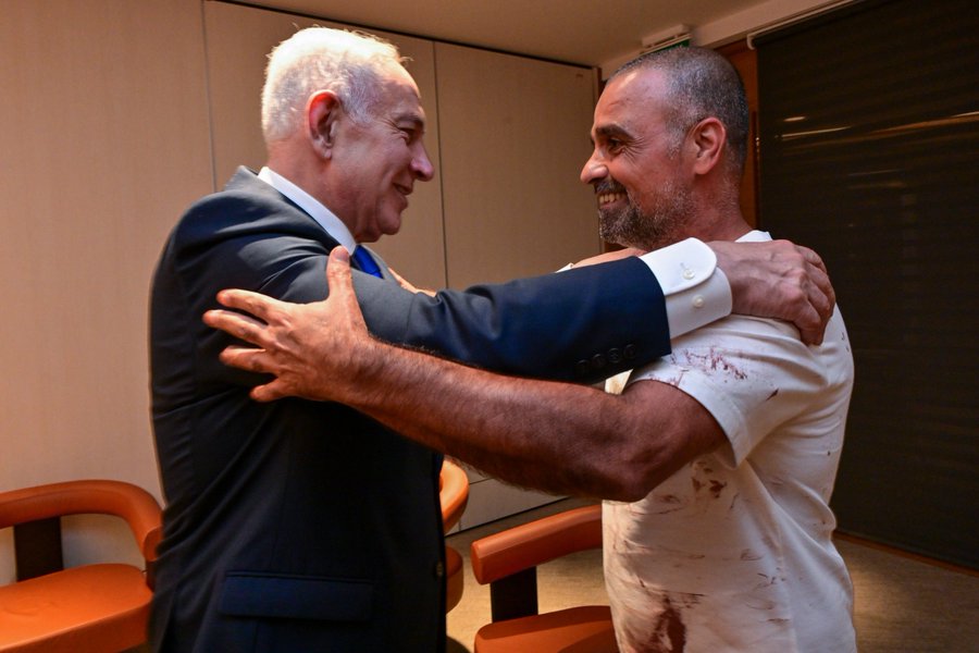 Prime Minister Benjamin Netanyahu at his Ben-Gurion International Airport meeting with Yaniv Hayun, the passenger who broke into the cockpit on the flight from Dubai to Israel