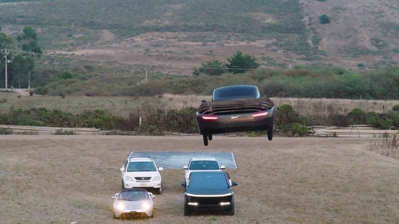 Alef flying over Tesla Roadster