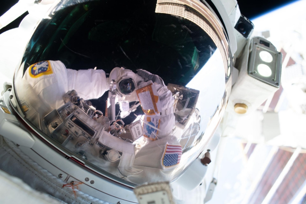 NASA astronaut Anil Menon points his camera toward his spacesuit’s helmet visor and takes an out-of-this-world “space selfie” during a spacewalk on Aug. 25, 2026..