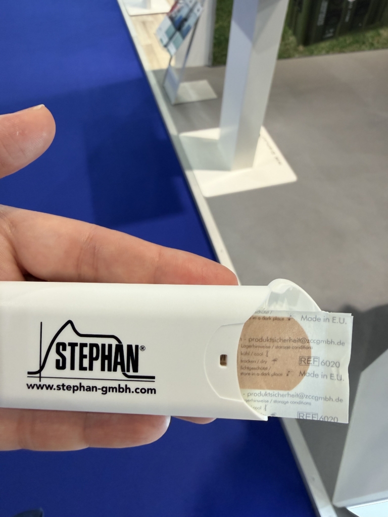 Stephen bandages defence marketing merch at Eurosatory